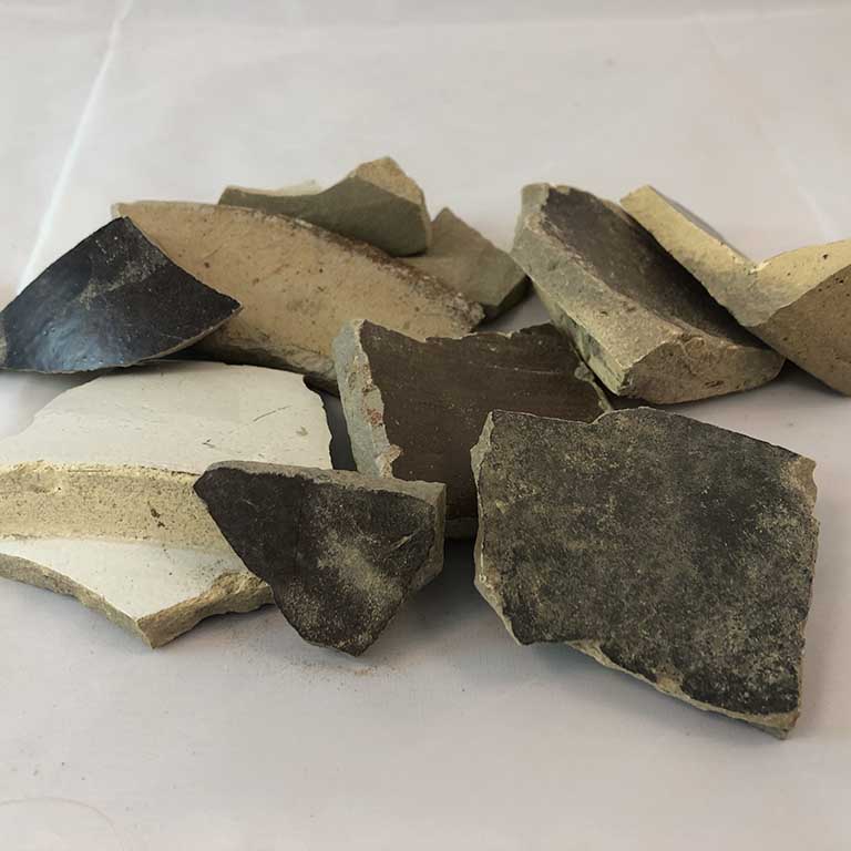 Broken glass-archaeological dig (black, brown, white)