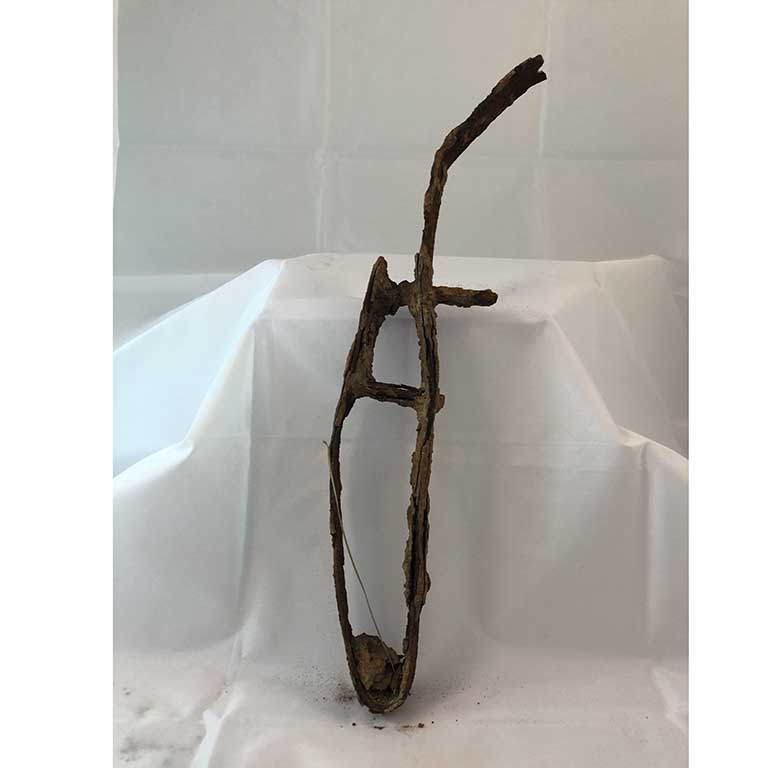 Rusted figure-archaeological dig